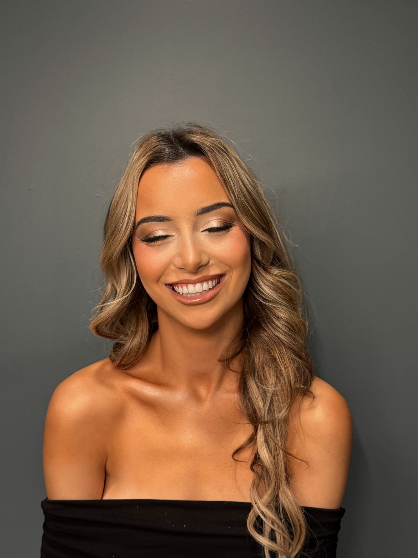 Smiling bride with radiant bridal makeup